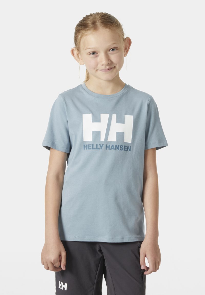 Camiseta de algodón azul claro con un audaz logo blanco "HH" y el texto "HELly HANSEN", de manga corta y cuello redondo.