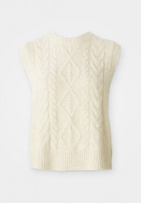 Strikærmeløs sweater i creme, med kabelmønstre, ribbet kant og rund halsudskæring. Blød tekstur med en afslappet pasform.