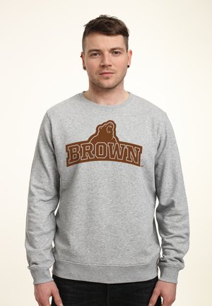 Šedá mikina vyrobená z bavlněné směsi, s hnědým logem "BROWN" a grafikou medvěda na přední straně. Žebrované manžety a lem.