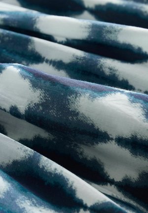 Lightweight fabric with a blue and white abstract pattern, featuring soft texture and fluid drape, ideal for apparel or home decor.