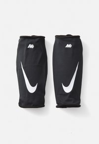 Sorte atletiske ærmer lavet af åndbart mesh-stof. Har iøjnefaldende hvide Nike- og M-logoer, med glatte, elastiske manchetter.