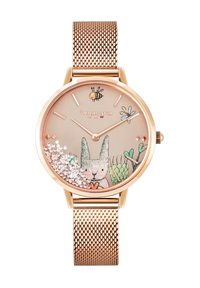 Okrągły zegarek w różowym złocie z siatkowym paskiem. Jasnobeżowa tarcza z ilustracją królika, pszczół, zieleni i błyszczącymi akcentami.