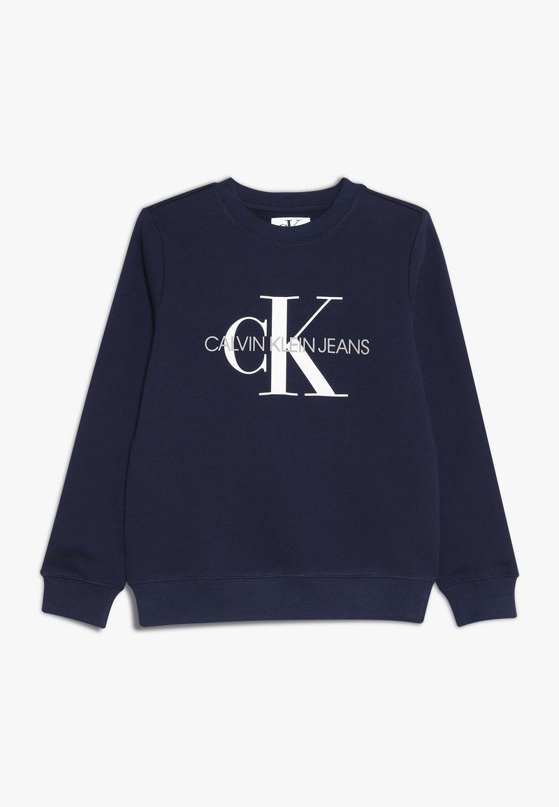 Puuvillainen laivastonsininen collegepaita, jossa pitkät hihat, pyöreä kaula-aukko ja suuri valkoinen "CK"-logo sekä "CALVIN KLEIN JEANS" -teksti alapuolella.
