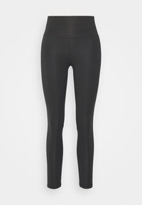Leggings negros con una cinturilla alta, hechos de una tela suave y elástica. El diseño no presenta patrones ni adornos.