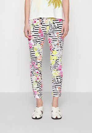 Mönstrade byxor med en blandning av blommönster och randiga designer i livliga färger, med tapered passform och mjukt tyg. Accentuerade med djärva bokstäver.