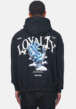 Black hoodie featuring a large graphic of a blue hand with a snake, clouds, and birds. Text reads "LOYALTY" in bold white letters.