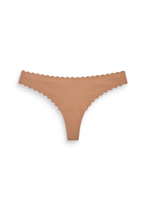 Perizoma nudo con bordi ondulati. Realizzato in un materiale morbido e liscio, presenta un design minimalista e bretelle sottili.