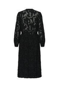 Schwarzes Kleid aus floraler Spitze mit langen, gepufften Ärmeln und tailliertem Schnitt, in knie-langer Länge und semi-transparenter Textur.