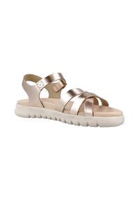 Sandalias metálicas de bronce con tiras entrelazadas, plantilla acolchada y suela de goma blanca texturizada para agarre y comodidad.