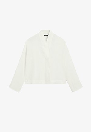 Haut kimono blanc à manches longues avec col large et coupe ample, présenté sur un fond blanc uni.