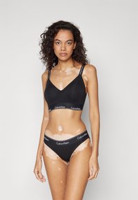 Calvin Klein Underwear LIGHTLY LINED ICON - Sujetador sin tirantes/multiescote - black