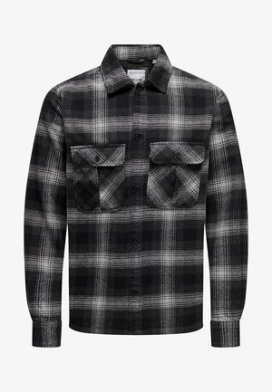 Chemise à carreaux noire et blanche en flanelle ; dotée de deux poches poitrine, d'un col et d'une fermeture à boutons ; manches longues avec poignets à boutons.