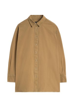 Lysebrun skjorte med spidst krave, lange ærmer og knapper foran. Har synlige syninger og store knapper.