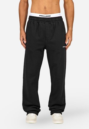 Pantalon de survêtement noir en mélange de coton. Doté d'une taille élastique avec le logo "PEGADOR", de poches latérales et d'une coupe droite.
