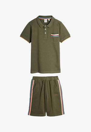 Olive green polo shirt with striped pocket trim and matching shorts featuring multicolor side stripes and elastic waistband.