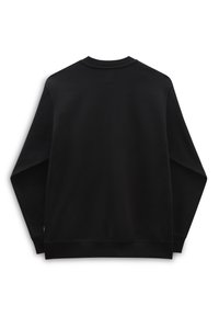 Sweat-shirt noir avec un col rond, des manches longues et des poignets côtelés. Texture lisse sans motifs visibles ni détails métalliques.
