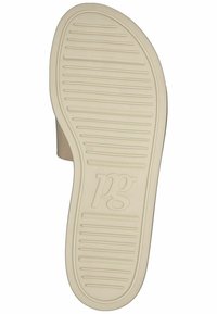 Sula i beige gummi med ribbad struktur för grepp, med en logotyp och en formad design. Utformad för komfort och halkbeständighet.