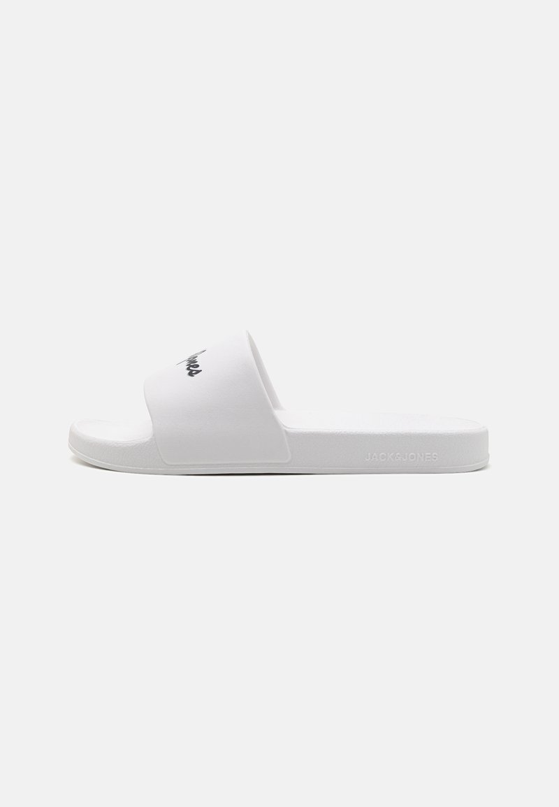 White slide sandal featuring a wide strap with a black logo. Made of smooth material with a flat sole and minimalistic design.