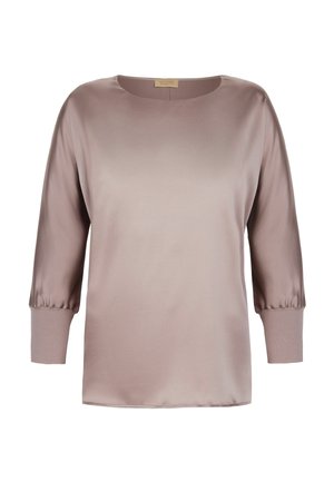 Blouse en satin mauve clair avec des manches bouffantes 3/4 et des poignets à larges côtes, col rond et coupe décontractée.
