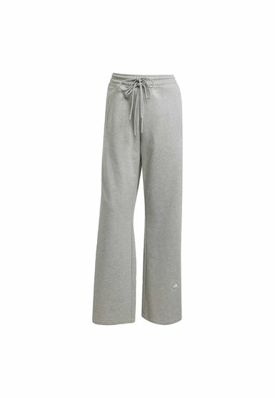 Svetlosivé tepláky vyrobené z mäkkého materiálu, s pružným pásom so šnúrkou, širokým strihom nohavíc a malým logom na dolnej časti ľavej nohavice.