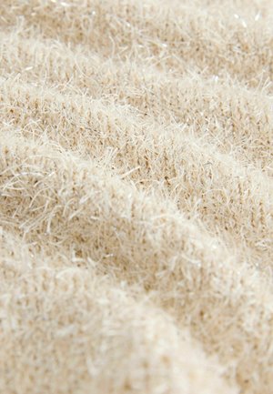 Struktureret stof i beige med fine, glitrende tråde. Materialet fremstår blødt og fluffy med en let ujævn overflade og dybdevariation.