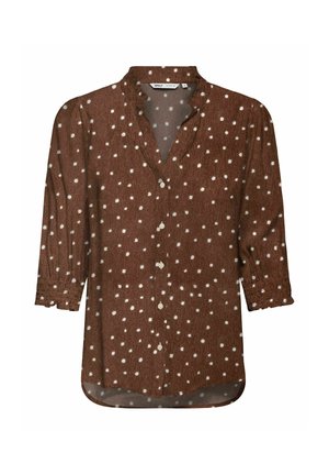 Blouse marron à manches longues avec des pois blancs, col en V avec des boutons sur le devant et des poignets légèrement froncés.