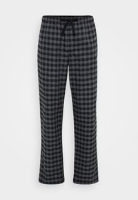 Pantalons de pyjama à carreaux gris et noirs avec une taille élastique et un cordon de serrage, présentant une coupe ample et une texture de tissu douce.