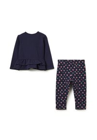 Navyblaues Langarmoberteil mit Rüschensaum, kombiniert mit navyblauen Leggings mit mehrfarbigem Blumenmuster. Aus weichem Baumwollmaterial.