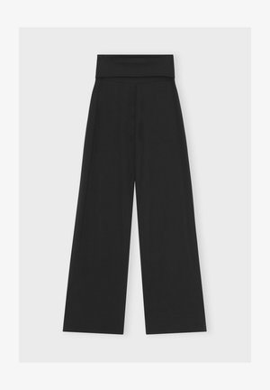 Wide-leg black pants with a thick waistband, smooth texture, and minimalist design. No visible fastenings or additional patterns.