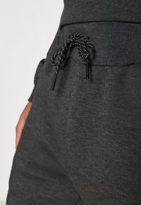 Ellesse Jogginghose - mottled black