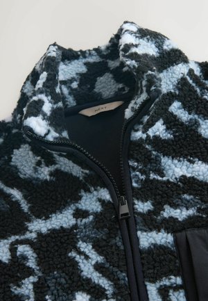 Fleece jacket with a black and light blue abstract pattern, high collar, and a front zipper. Features a smooth fabric lining and textured exterior.