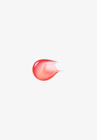 Un gel translucido, a forma di goccia, nei toni del rosa e del rosso, con una finitura lucida e piccole bolle all'interno.