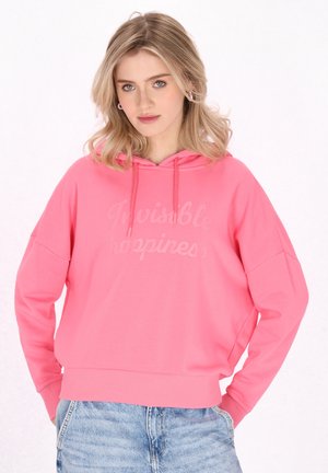 Felpa con cappuccio rosa dal fitting morbido, caratterizzata da una consistenza soffice e con la scritta "Felice invisibile" stampata in una tonalità più chiara sul davanti.