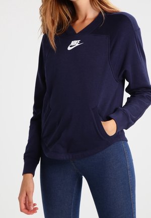Marineblauwe Nike sweatshirt met V-hals, lange mouwen en een centraal logo; heeft twee voorzakken en een losse pasvorm.