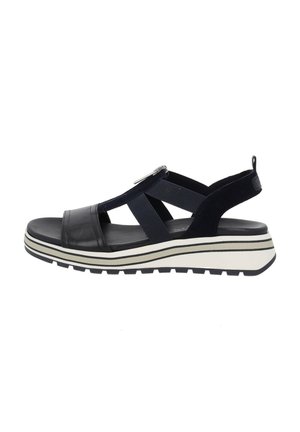 Marineblaue Sandale aus einer Mischung von Leder und Stoff, verstellbarer Riemen, dicke weiße Sohle mit schwarzen Akzenten und offenes Zehendesign.