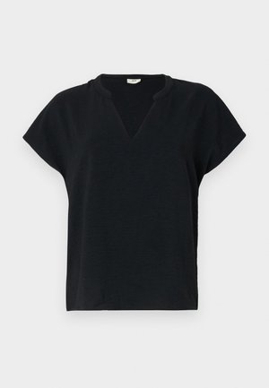 Black short-sleeve top with a V-neck, made from textured fabric. Slightly loose fit with rounded shoulder seams.