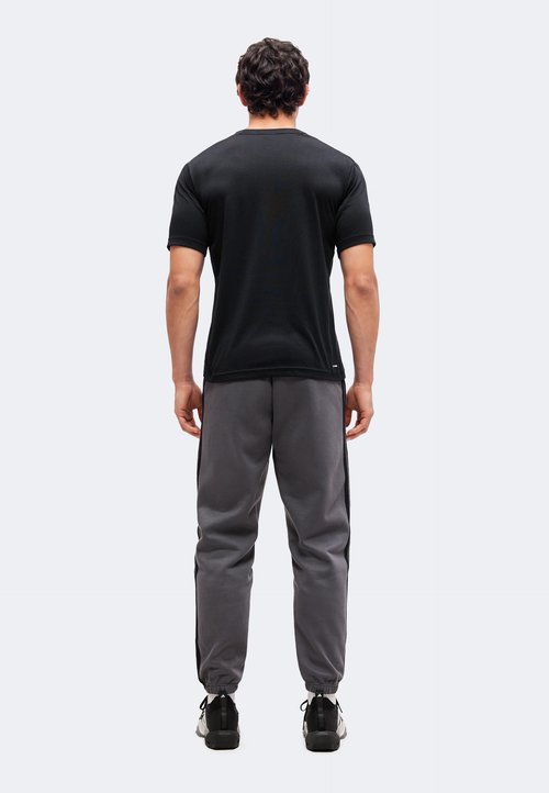 adidas ESSENTIALS 3 STRIPES TAPERED CUFFED PANTS - Tracksuit bottoms - grey five/black — foto 3