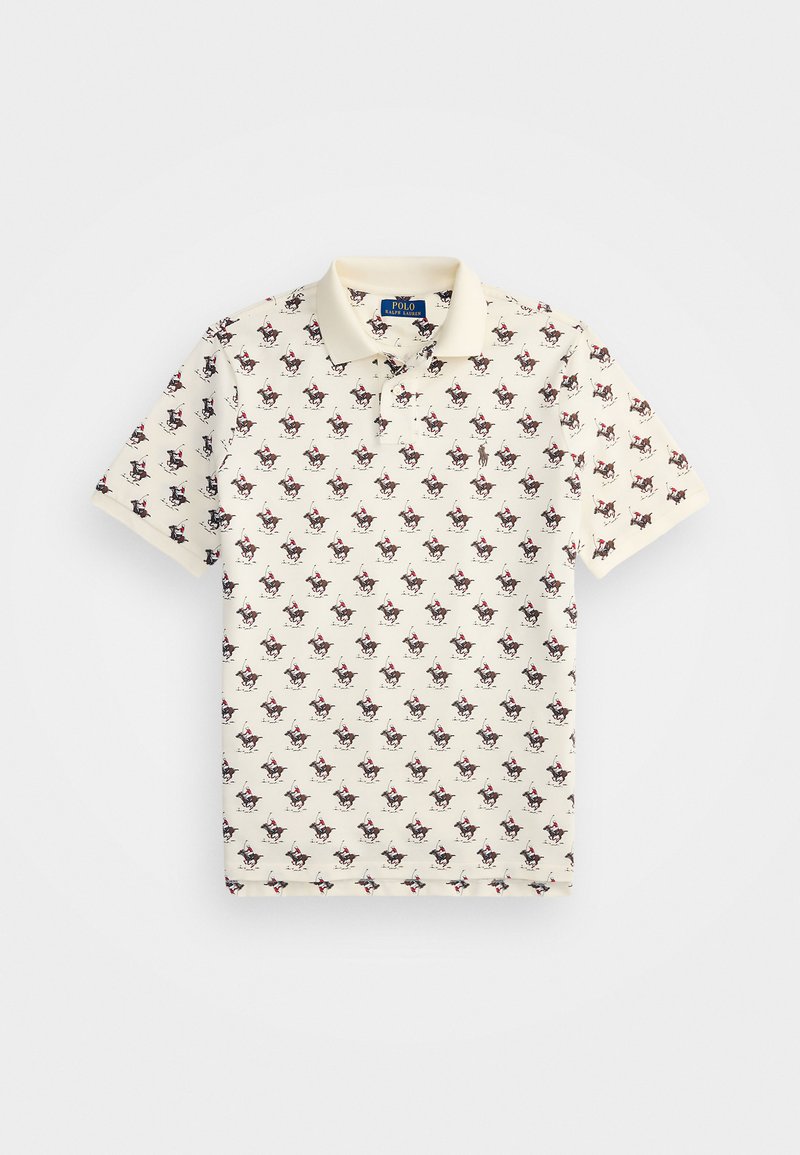 Beige puuvillane polo särk, millel on korduv muster väikestest, värvilistest ratsanikest. Klassikaline krae ja lühikesed varrukad.