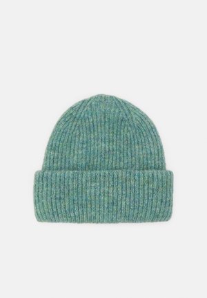 Knitted beanie in soft green hues, featuring a ribbed texture, folded cuff, and smooth finish. Ideal for warmth and comfort.