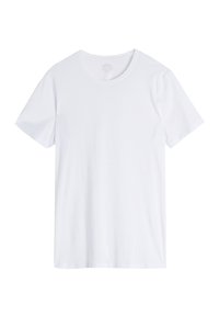 Camiseta blanca de manga corta hecha de algodón suave. Presenta un escote redondo y un corte recto sin patrones ni embellishments.
