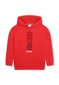 Felpa rossa con cappuccio e tasca a marsupio, con testo verticale bianco e nero: "SII IL TUO PATRON". Realizzata in tessuto misto cotone.