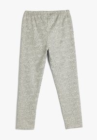 Lysegrå leggings med elastisk talje, der har et gentaget "LOVE" tekstmønster i varierende størrelser over hele stoffet.