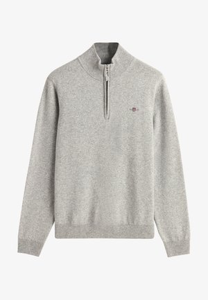 Lichtgrijze pullover trui met een hoge kraag en ritssluiting. Gemaakt van zacht stof, met ribgebreide manchetten en zoom en een klein logo op de borst.