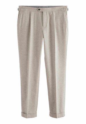 Heledad hallhallikad, mis on kitsendatud ja volditud. Valmistatud pehmest kangast, varustatud nupuga ja keeratud pahkluuli ning tavaliste taskutega.