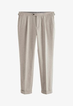 Light gray, pleated trousers with a tapered fit. Made from a soft fabric, featuring a button closure and rolled cuffs. Standard pockets included.