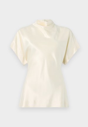 Ivory satin top with a high neckline, short sleeves, and a slight flare at the hem. Features a discreet back zipper. Smooth texture.