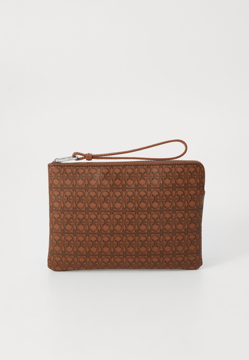 Brown clutch bag made of textured material, featuring a geometric pattern, zip closure, and a wrist strap for easy carrying.