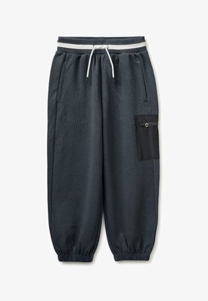 Pantaloni della tuta grigio scuro con polsini elasticizzati, vita con coulisse bianca, tasche laterali e tasca nera con zip sulla gamba destra.