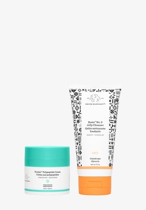 Two skincare products: a white jar with a turquoise lid and a white tube with colorful graphics, featuring orange accents and black patterns.