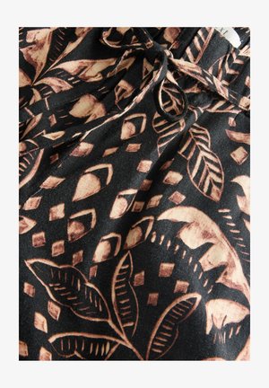 Tessuto nero con motivi astratti di foglie e geometrici in beige e marrone chiaro. Include una vita elastica con coulisse.